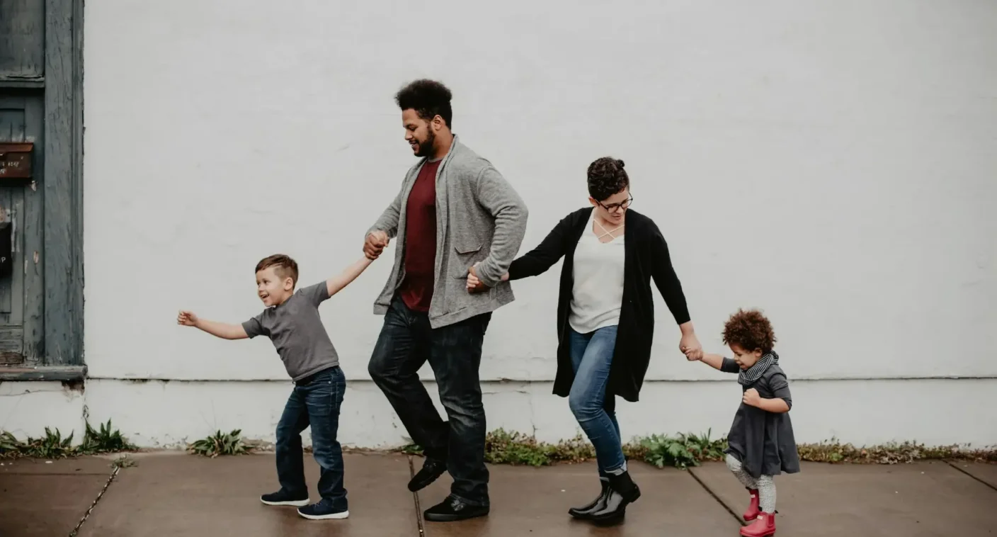 A parent and children walking together