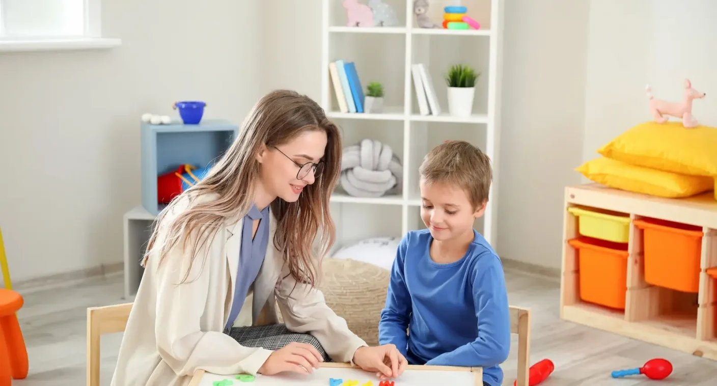 A counselor and a student working together at a table