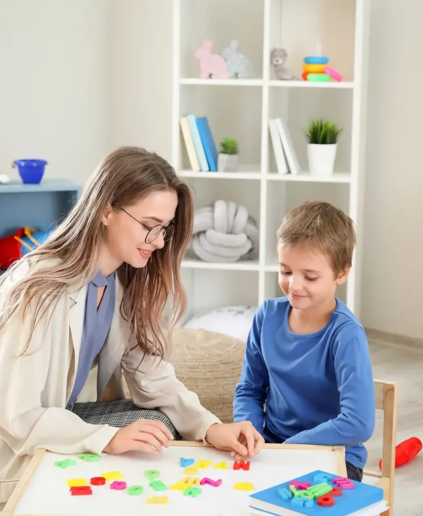 A counselor and a student working together at a table