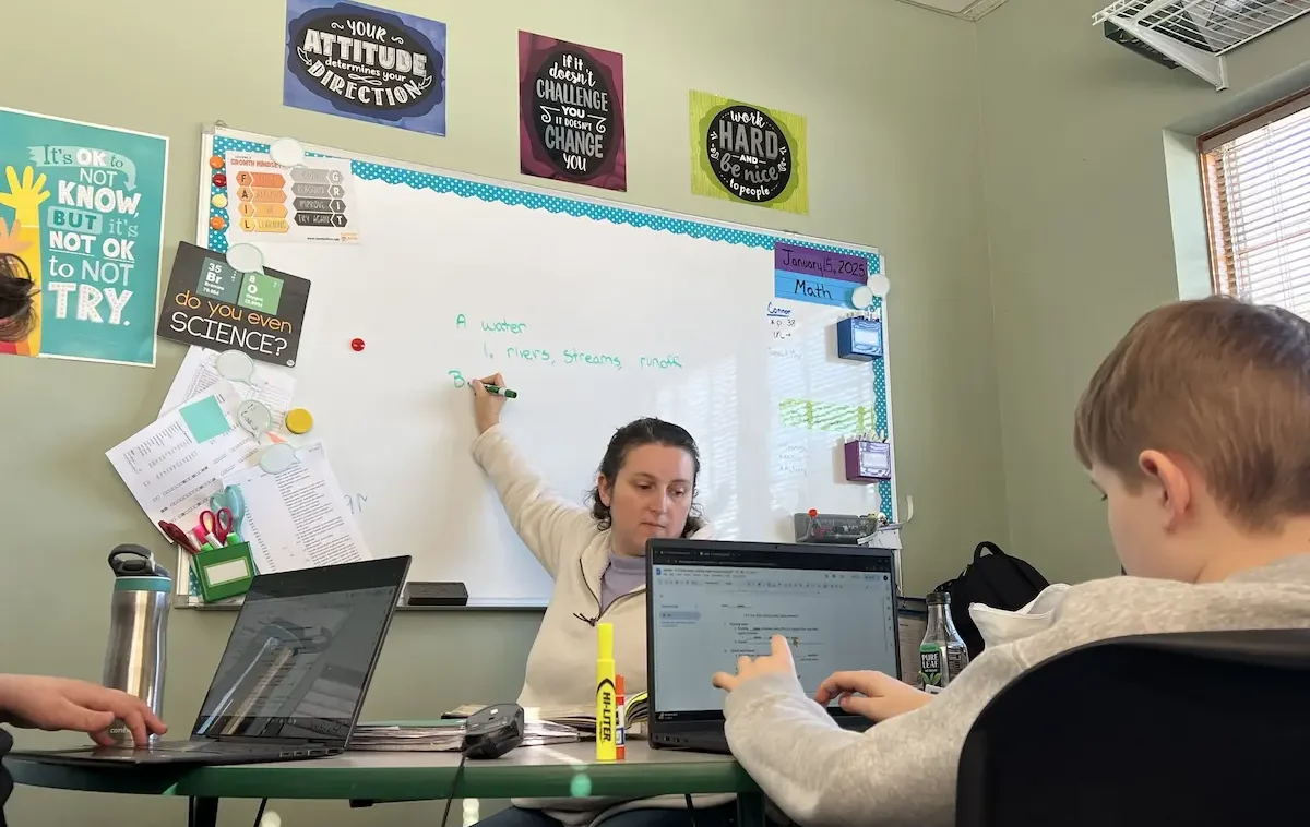 A Balanced Learning Academy classroom with students at their laptops