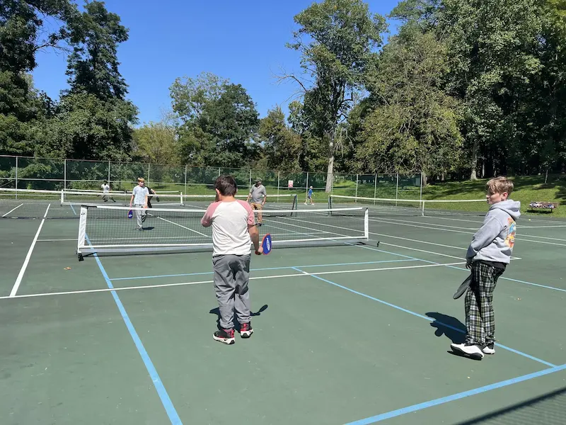 Students on a tennis court after class